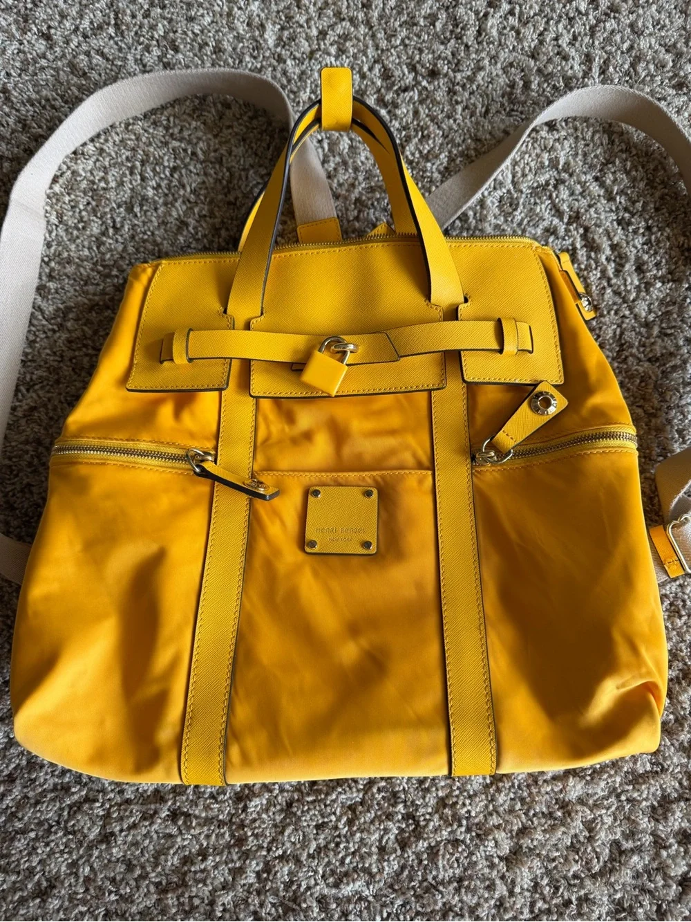 Henri Bendel Bright Yellow Backpack Tote with Gold Hardware and purple interior